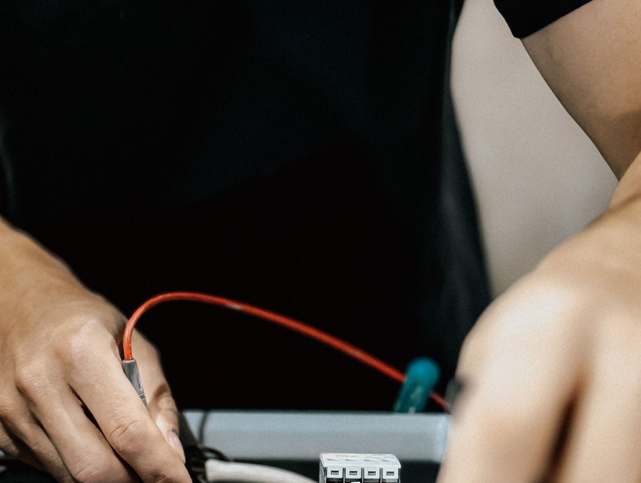 A technician wiring a smart device on site